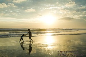 father and daughter at beach